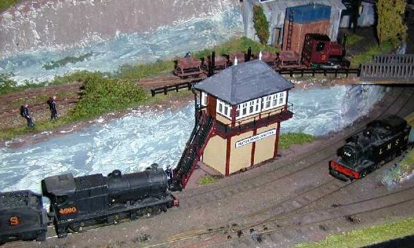 A glimpse of the mine works behind the narrow gauge train. All L.M.S. locomotives on the layout carry numbers associated with the Somerset and Dorset Joint Railway