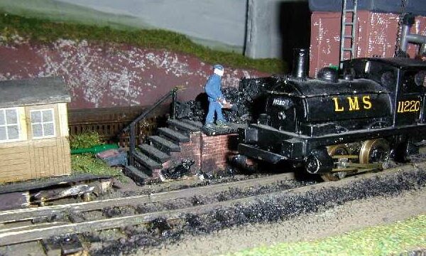A close up view of the Pug beside the coaling dock.