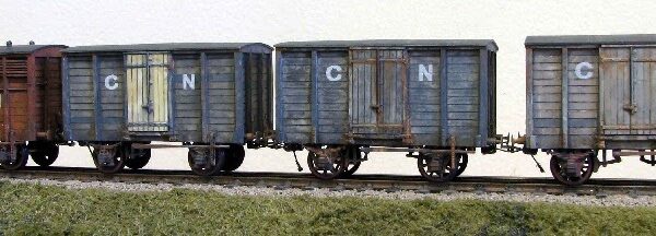 a variety of wagons built by Mick Rawlings and painted by John Sutton for the layout