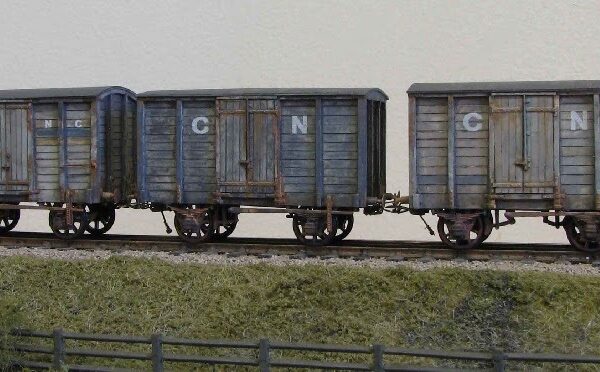 a variety of wagons built by Mick Rawlings and painted by John Sutton for the layout